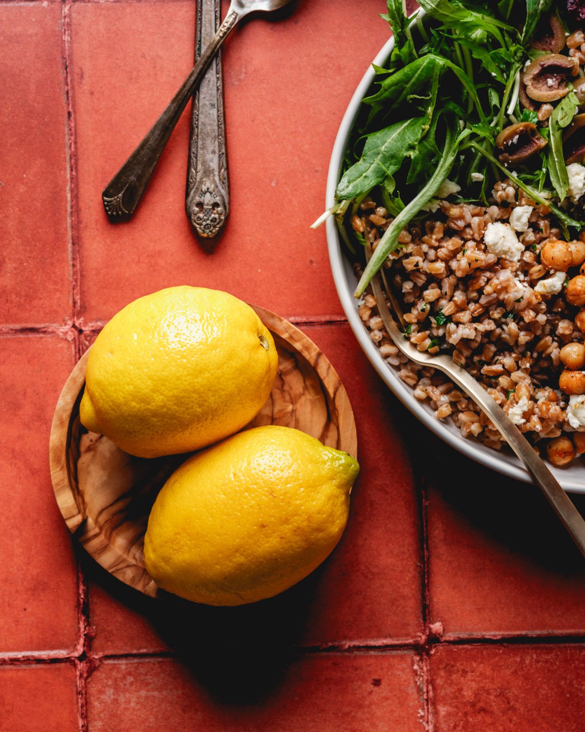 Lemons on plate with farro grain bowl