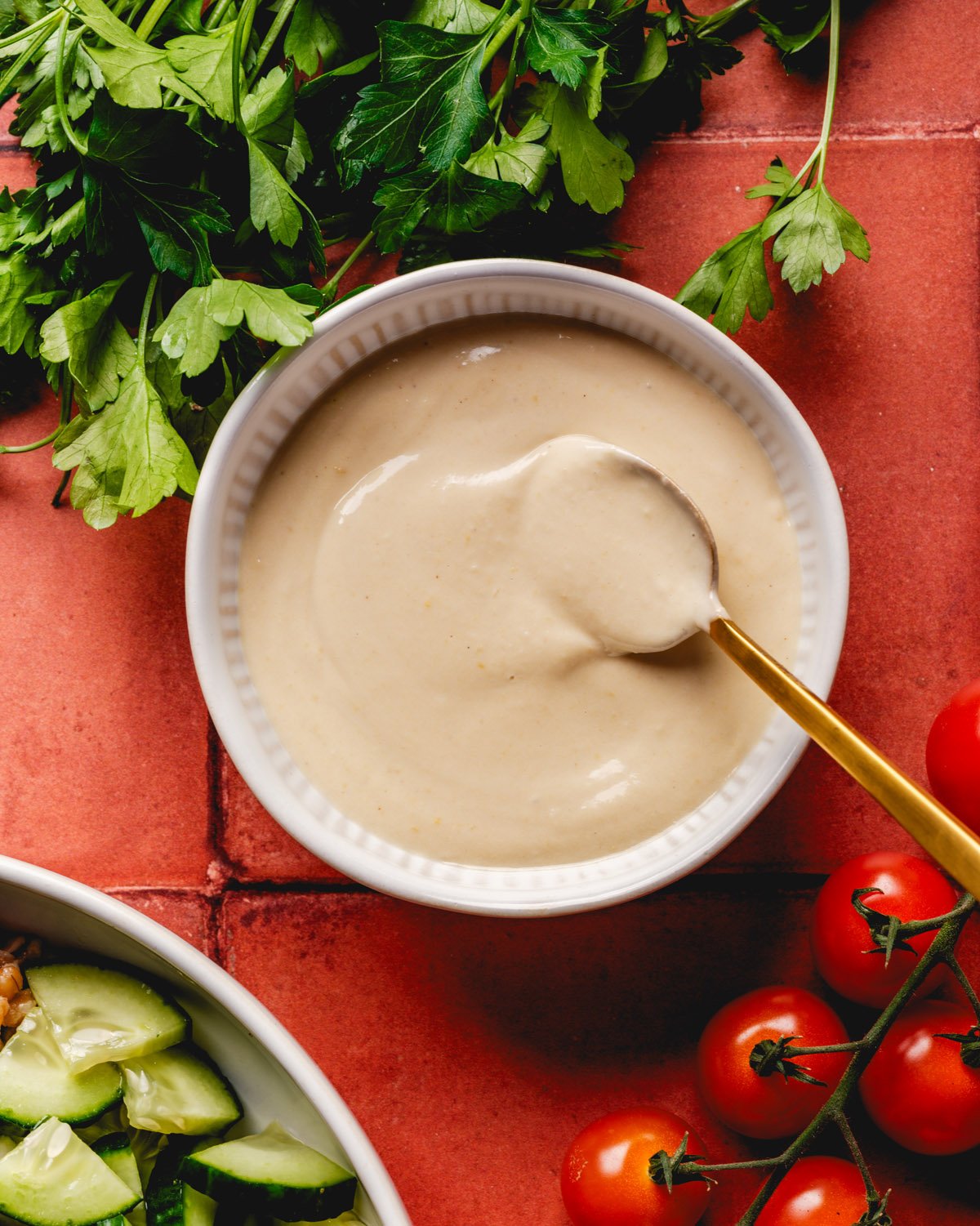 Hummus dressing in bowl with spoon