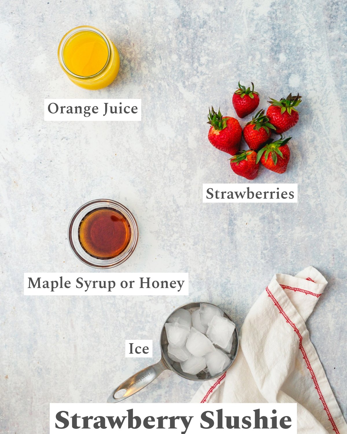 Ingredients in a strawberry slushie: strawberries, maple syrup, orange juice, ice