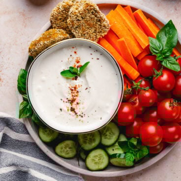 Tahini Yogurt Sauce in bowl with vegetables.