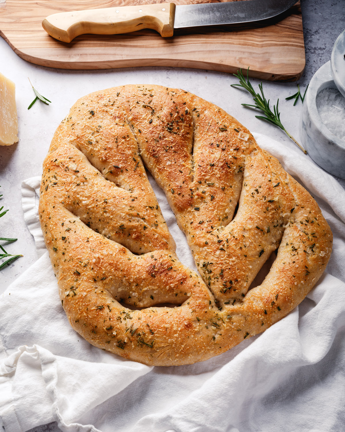 Fougasse Bread on towel with knife.
