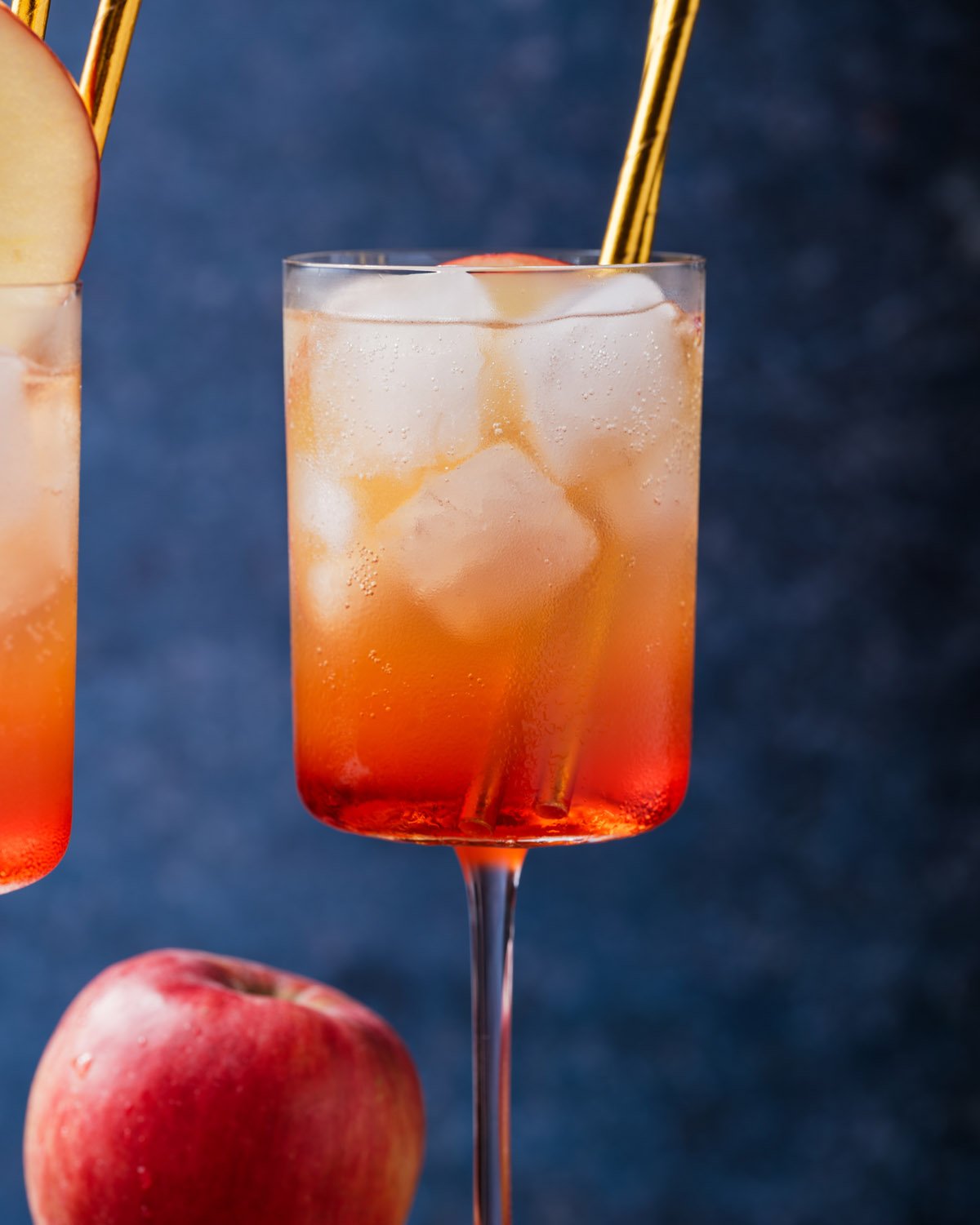 Apple Cider Spritz  in glass with ice and straw
