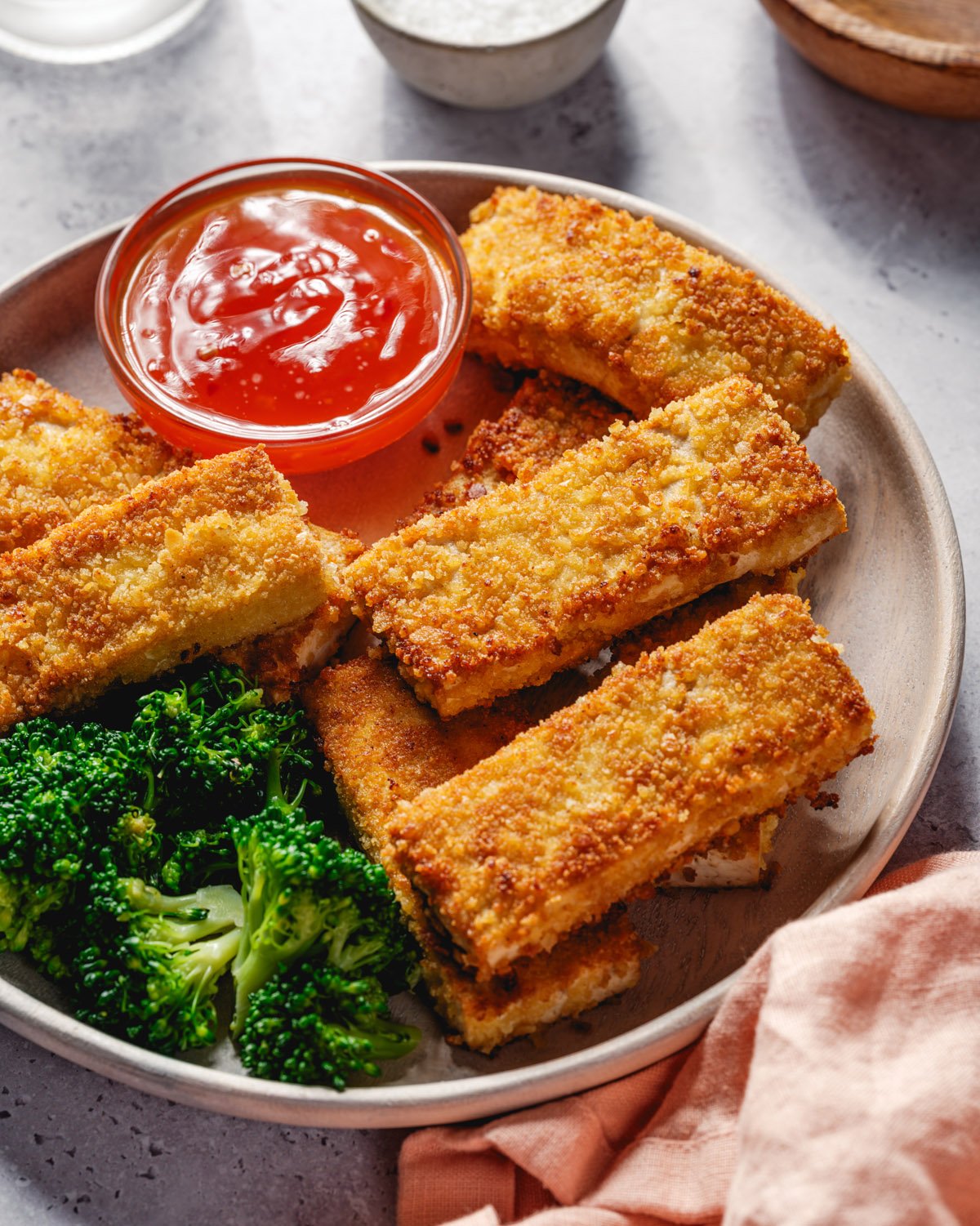 Breaded tofu with dipping sauce and broccoli