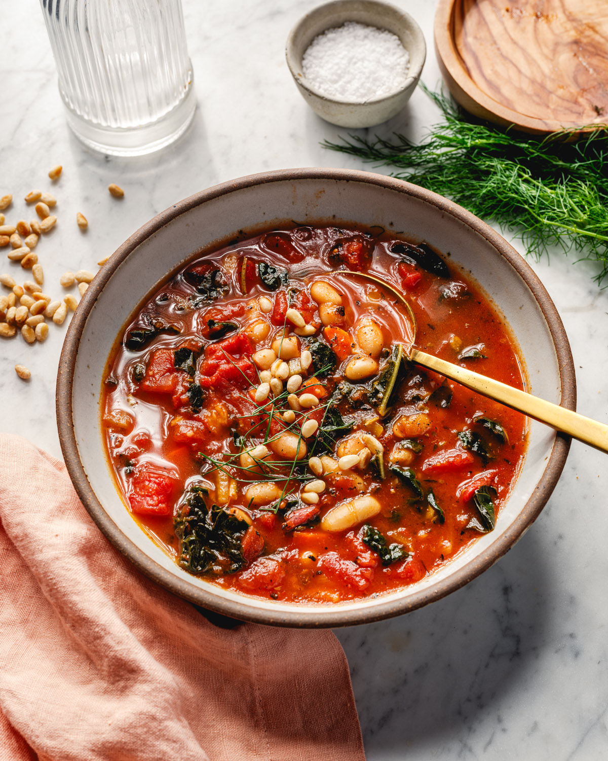 Kale and White Bean Soup in bowl with spoon