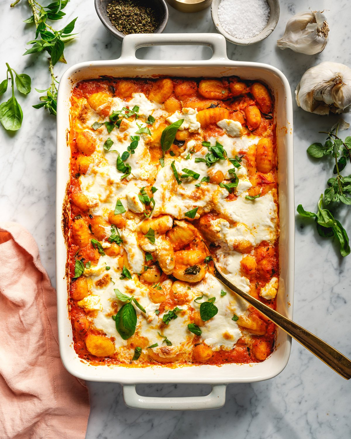 Baked gnocchi in pan with spoon