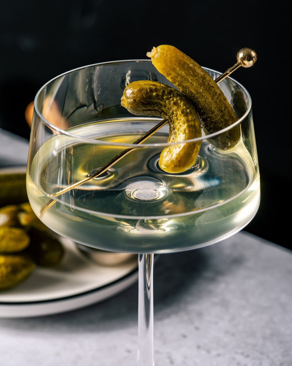 Dill pickle martini with pickle garnish