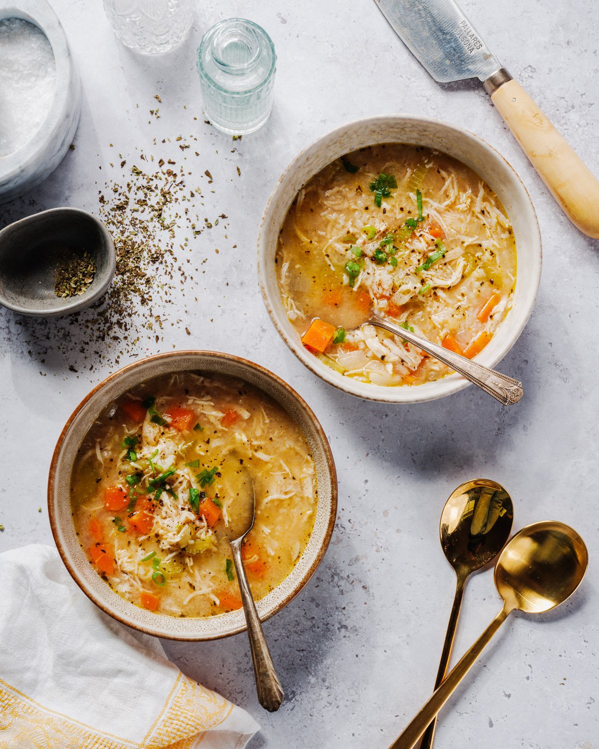 Chicken and Rice Soup  with bowls and spoons