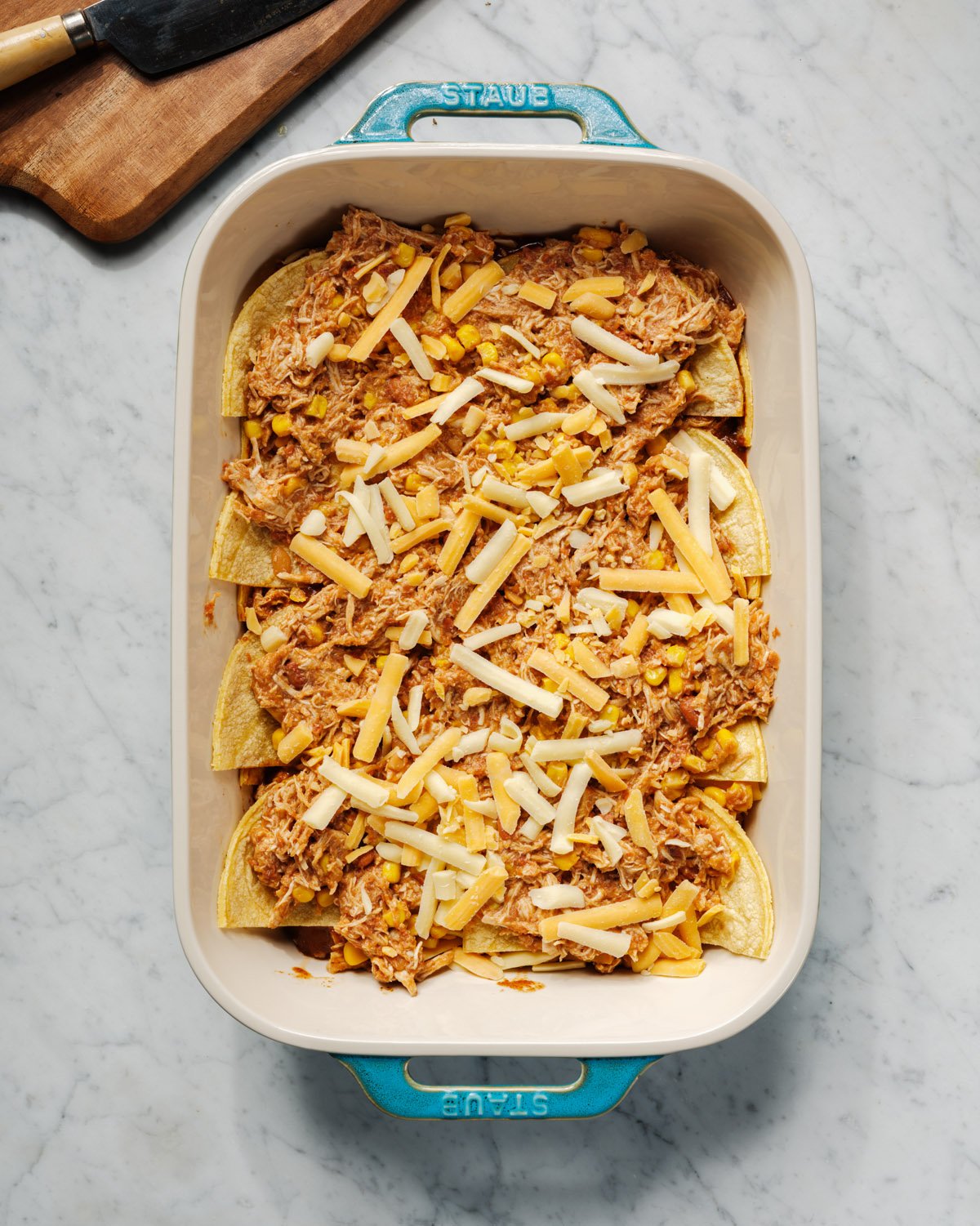How to make Enchilada Casserole: layering the filling