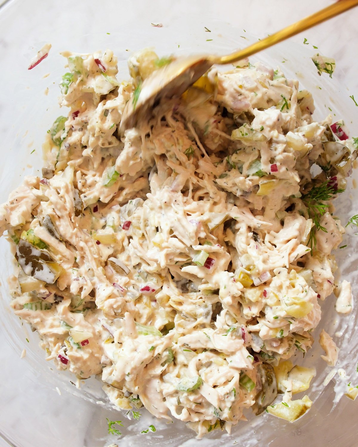 Dill Pickle Chicken Salad stirring in bowl